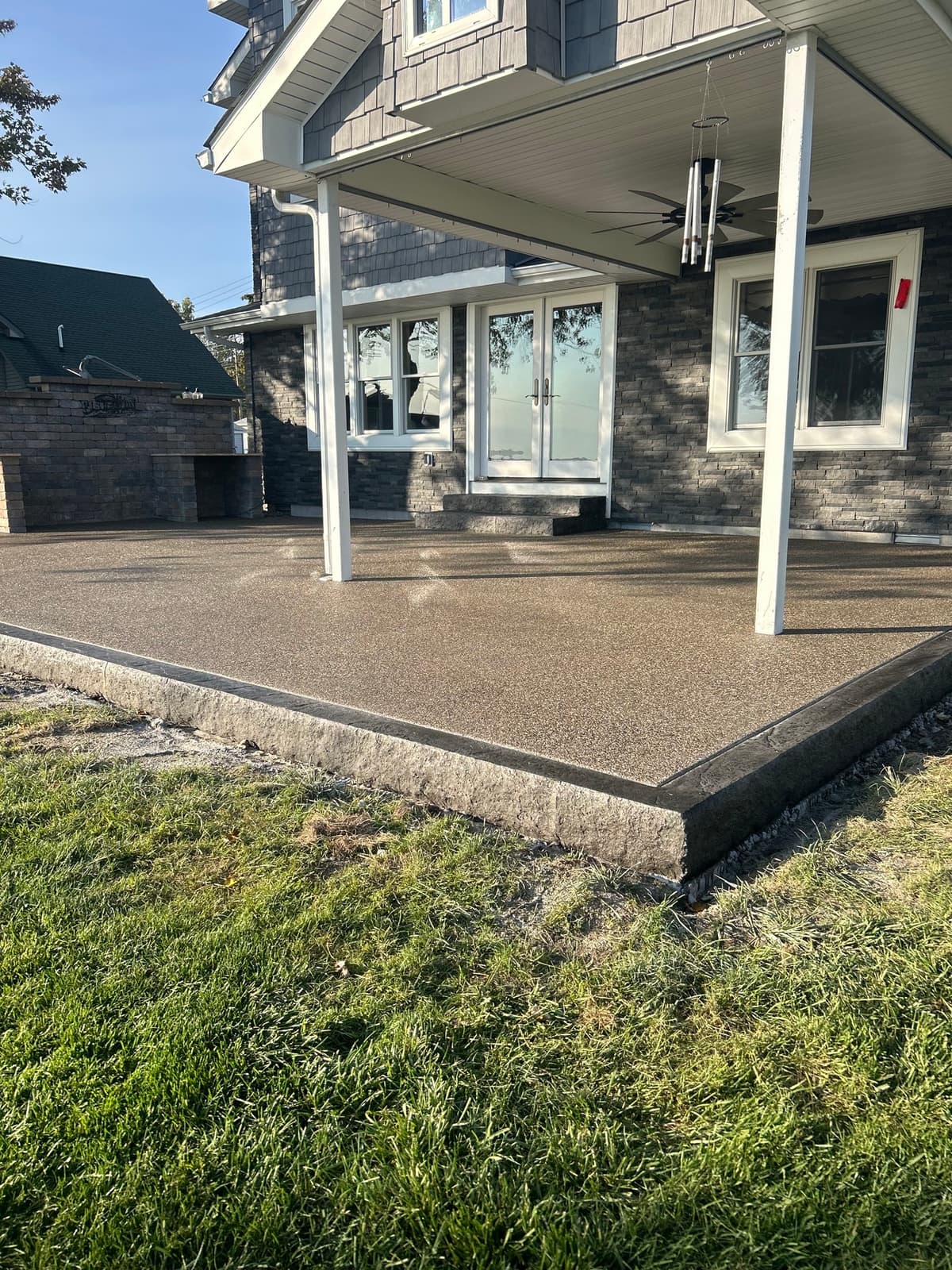 Backyard Patio with Stone Border — photo 2